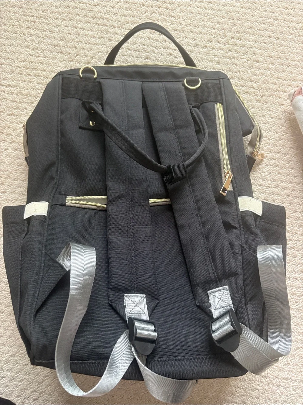 Amazon Black Baby Bag Backpack with Gold Accents